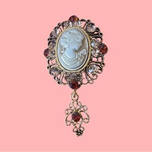 Elegant Cameo Brooch with Red and Gold Accents